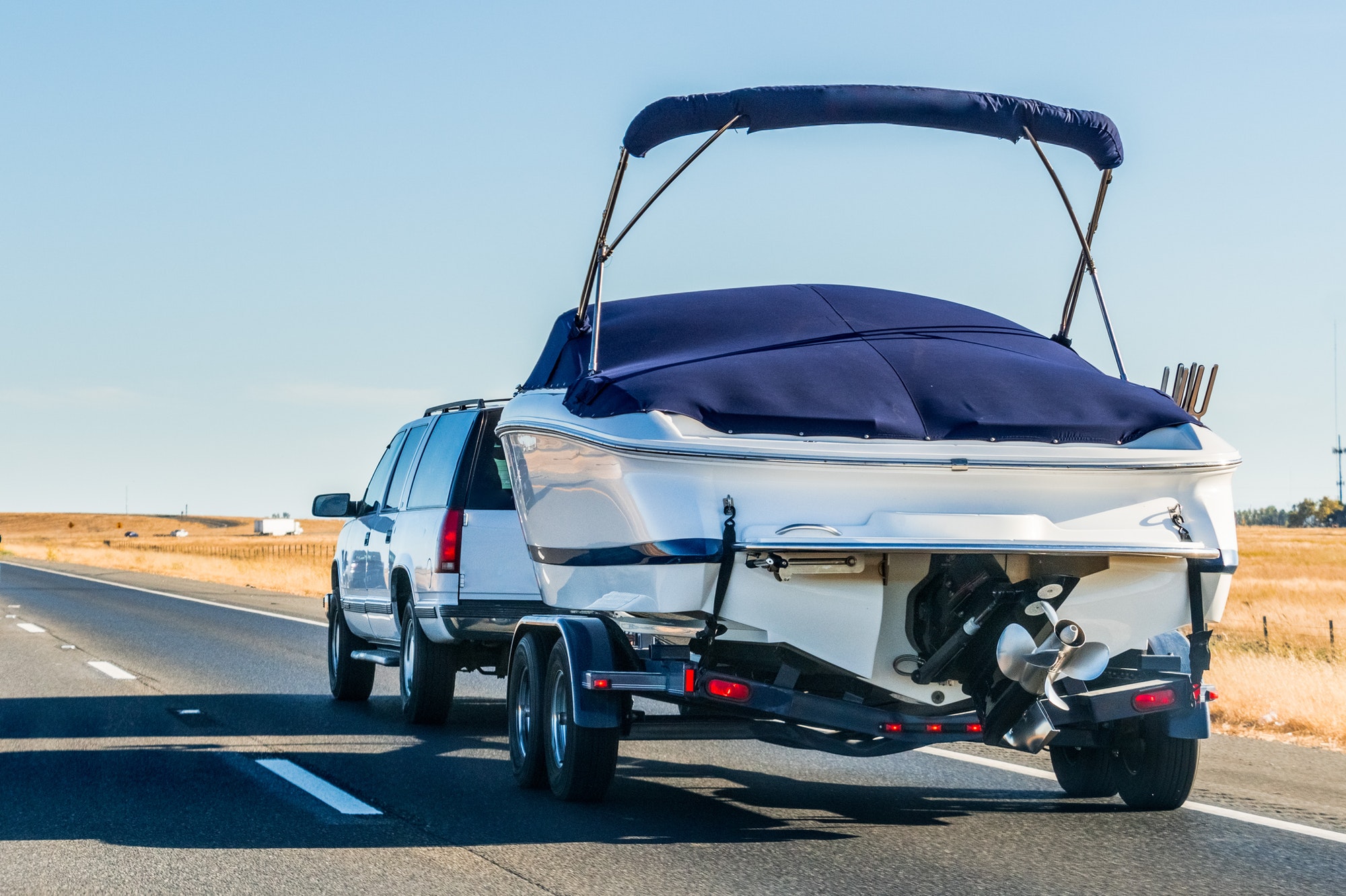 Truck towing a boat on the interstate, California
