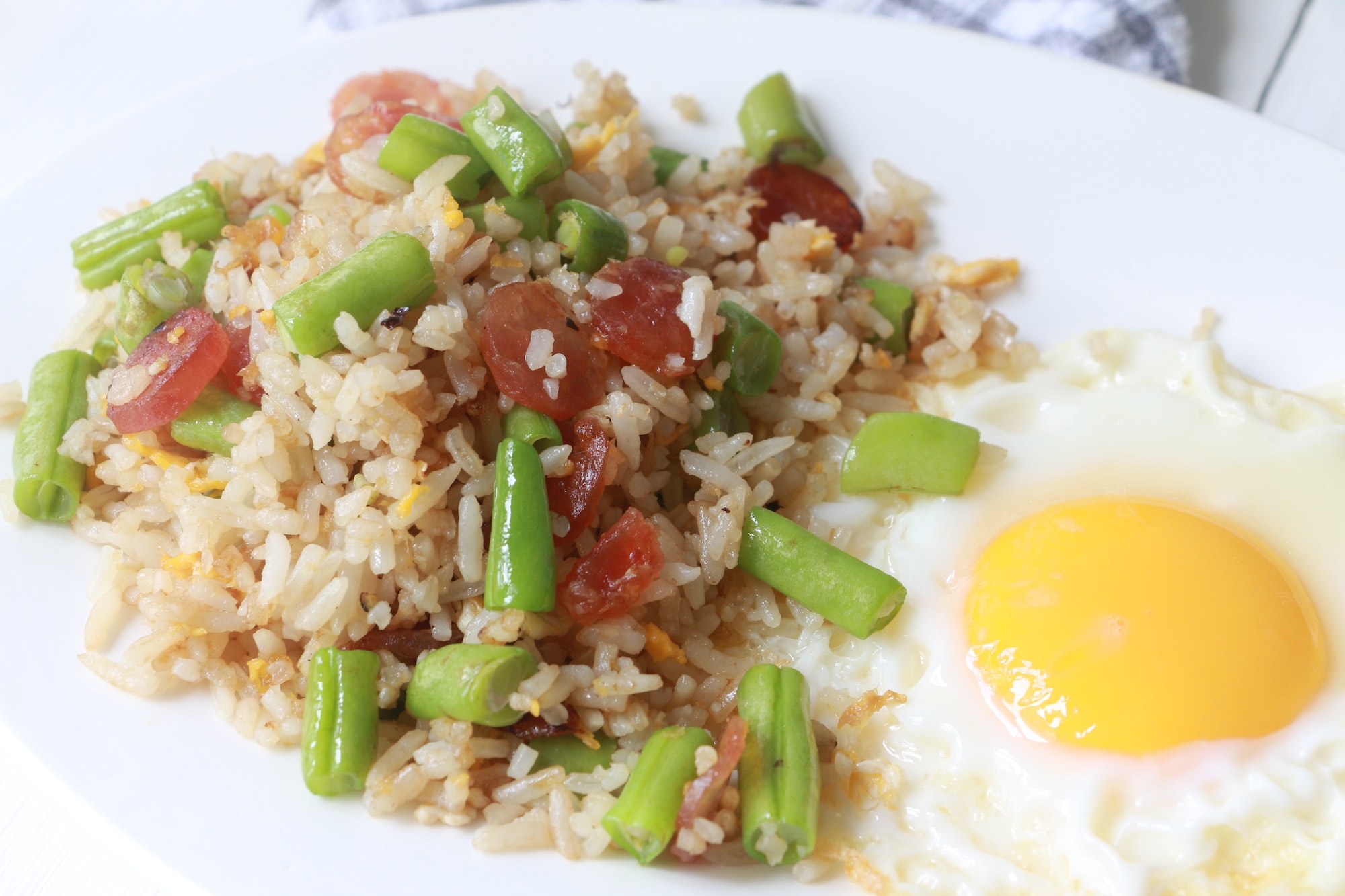 Fried rice with Chinese sausage, green bean and fried egg
