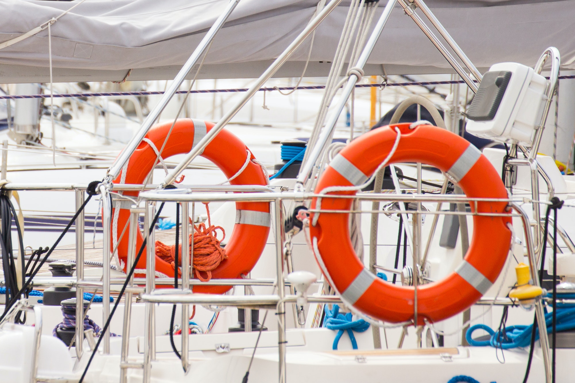 Parts of yacht, Orange lifebuoy on sailboat, safety travel concept