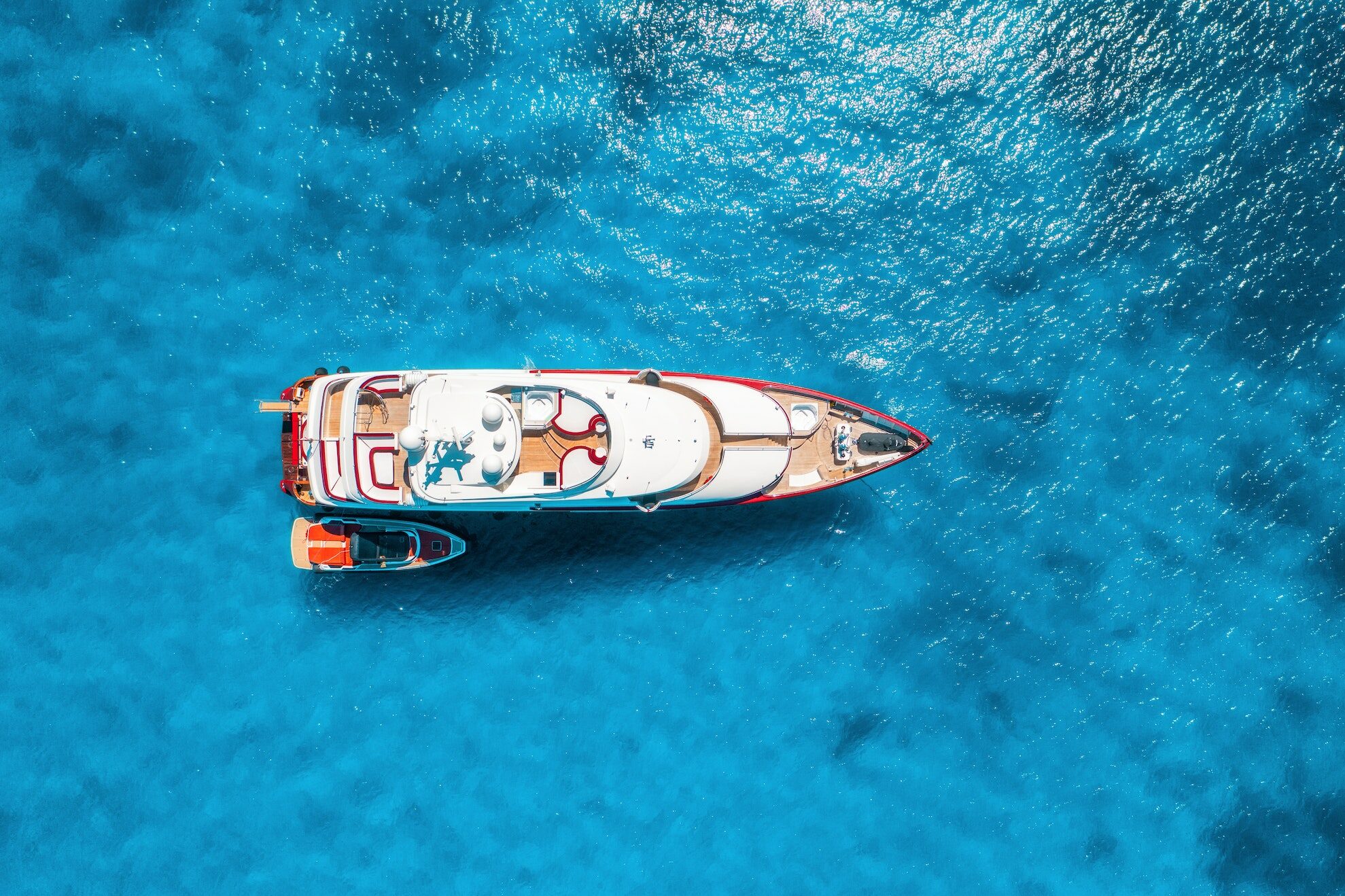 Aerial view of beautiful luxury yacht and boat in blue sea