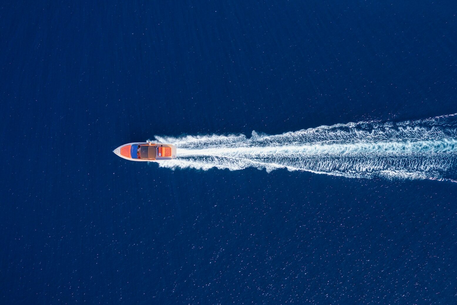 Fast boat at the sea in Bali, Indonesia. Aerial view of luxury floating boat