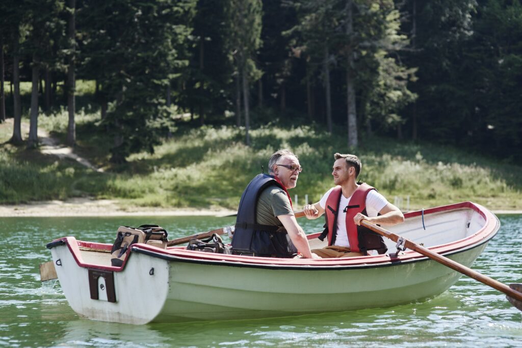 Men on a rowboat during fishing trip