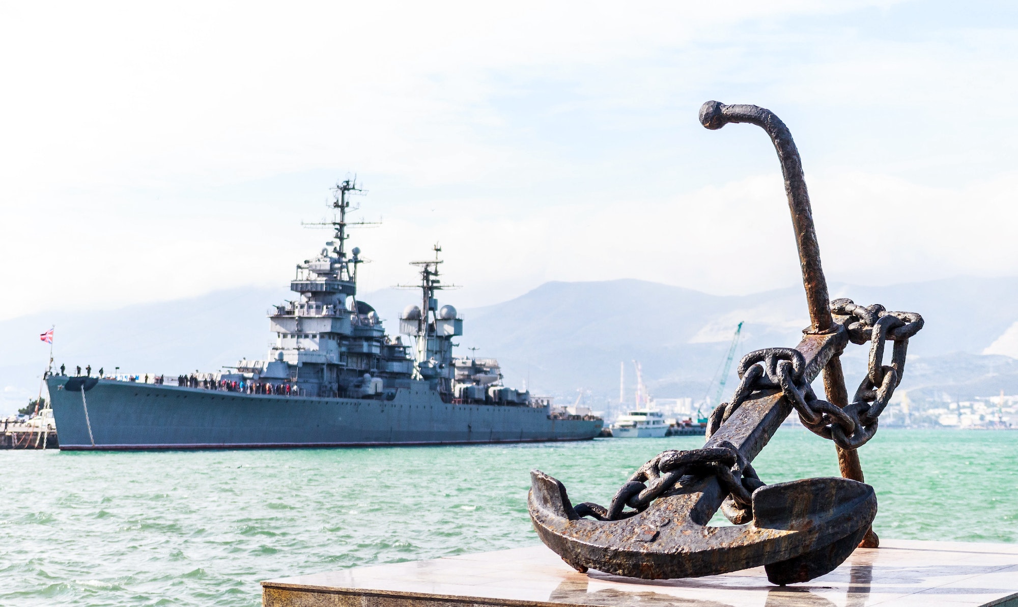 Anchor on the background of a warship in the port