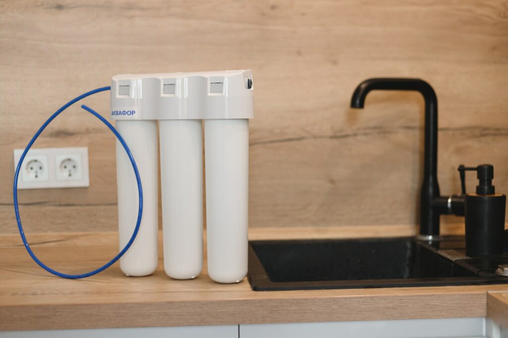 Household water purification system. Three-stage water treatment and softening system.