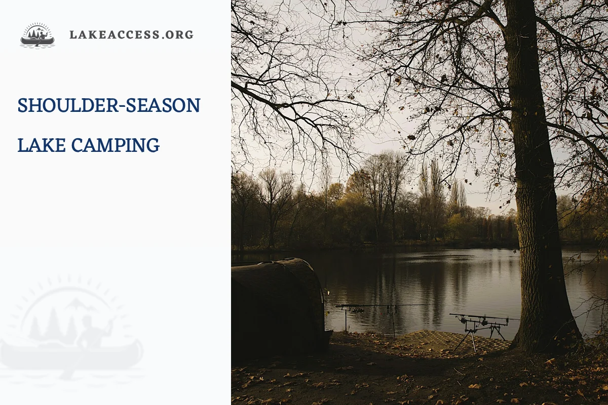 A fishing tent beside a calm lake with bare autumn trees, representing short daylight, cold water and changing shoulder-season services.